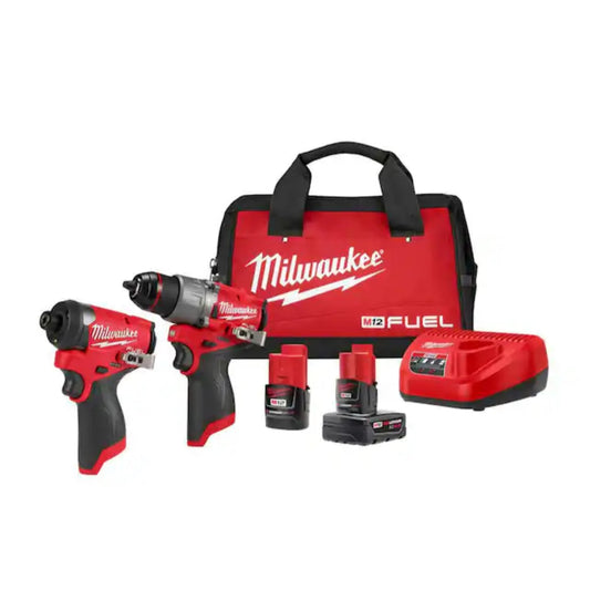 Milwaukee tool set with two drills, batteries, and a carrying case on a white background